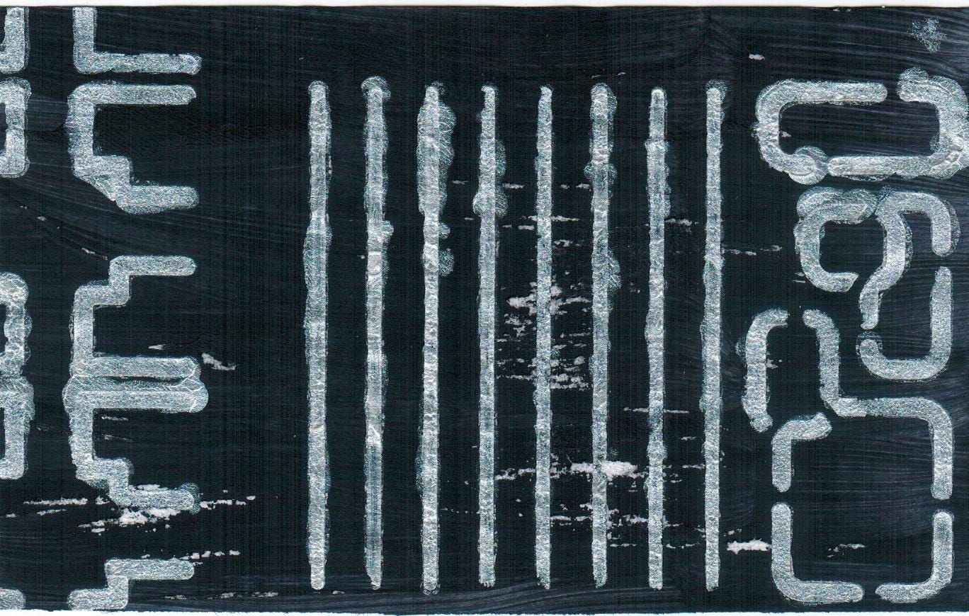 White stenciled paint over navy blue background