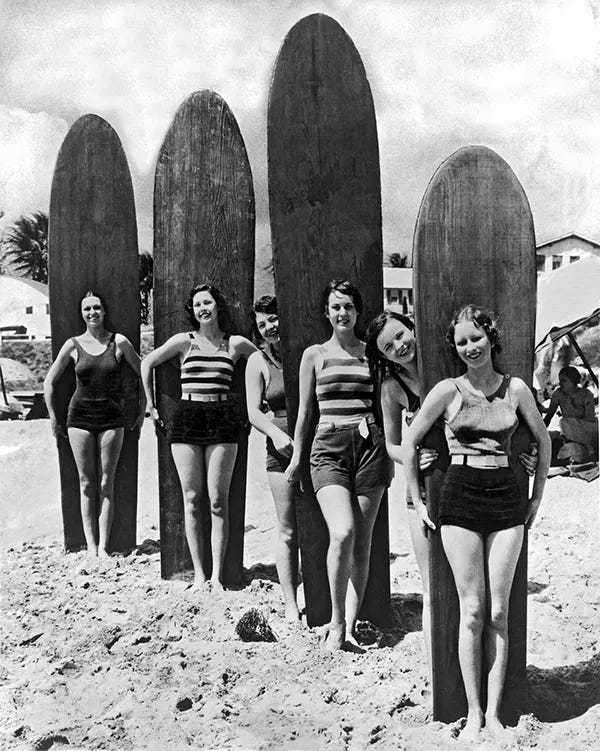 Six young women with their surfboards on a Southern California beach, circa late 1920s/early 1930s. Six young women with their surfboards on a Southern California beach, circa late 1920s/early 1930s.