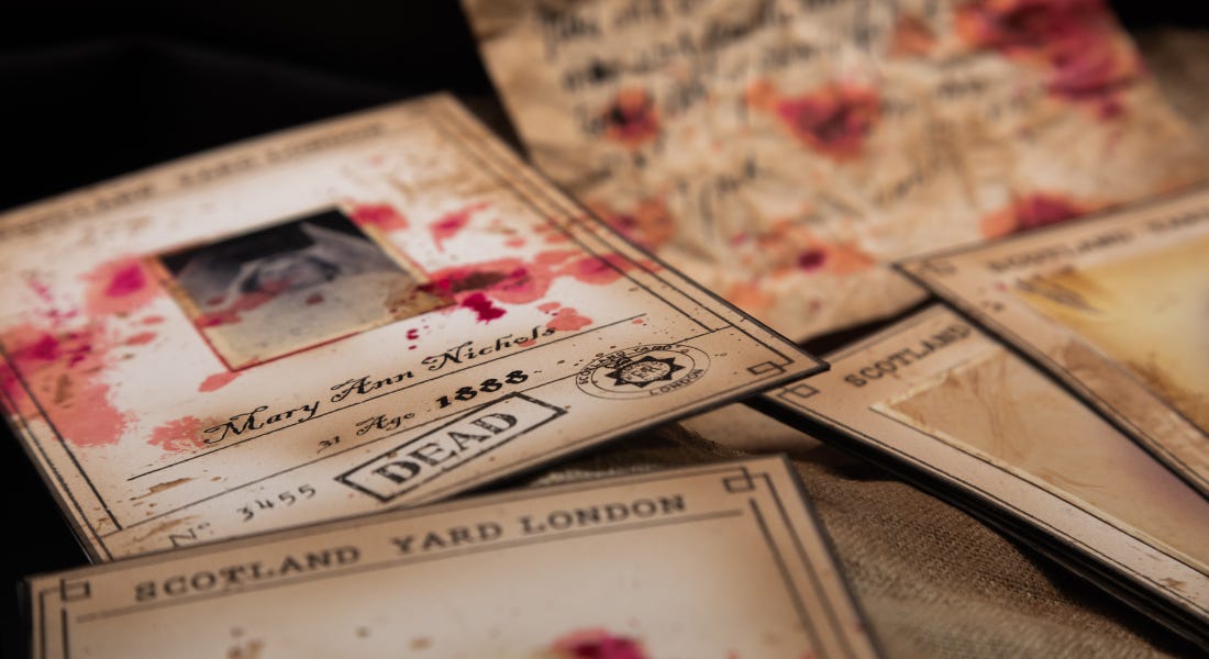 A collection of light brown paper leaflets with red splatters on them A collection of light brown paper leaflets with red splatters on them