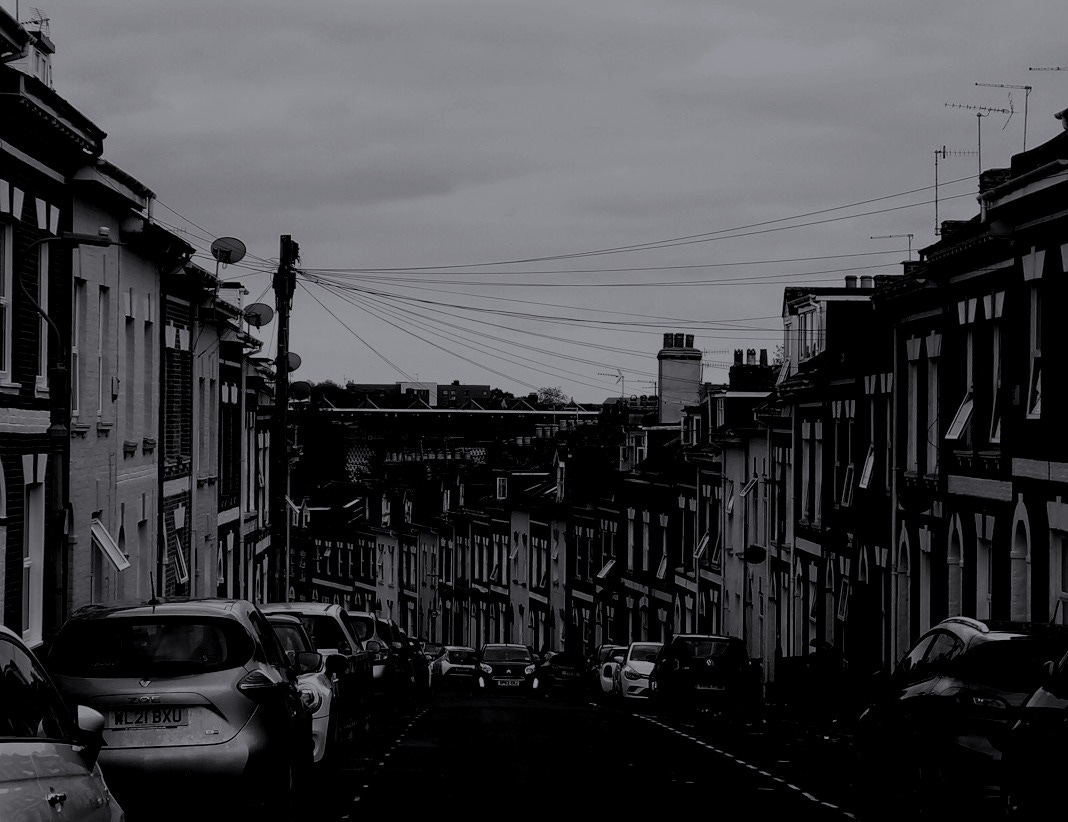 A black and white photo of a city street