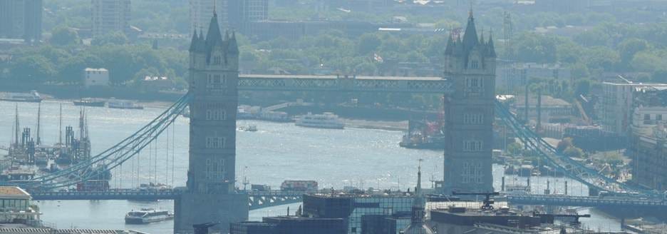 A cityscape with a bridge and a river

AI-generated content may be incorrect.