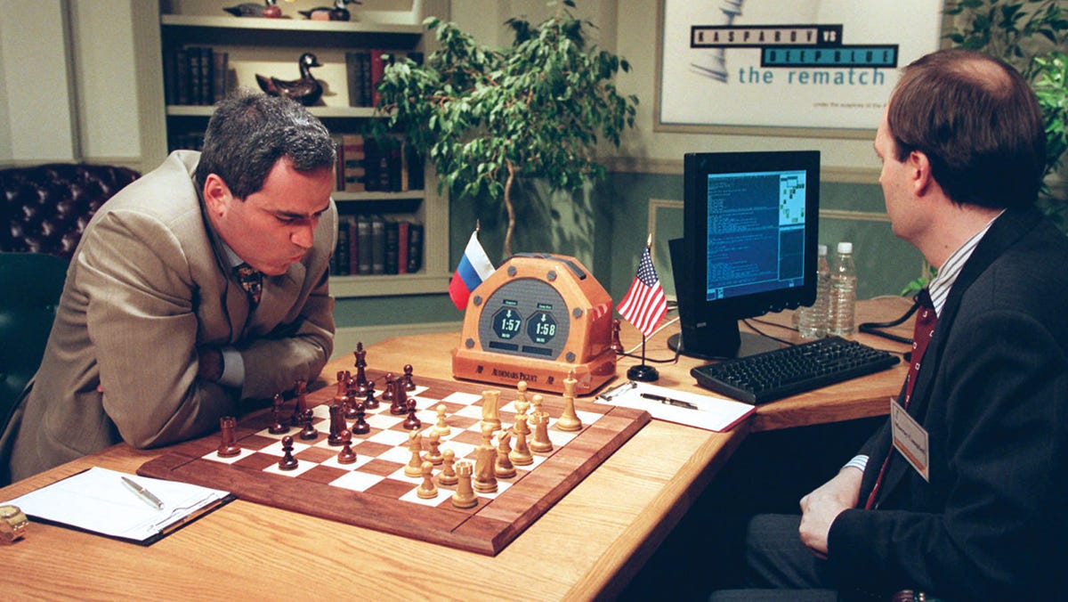 Men playing chess in a room

Description automatically generated with low confidence
