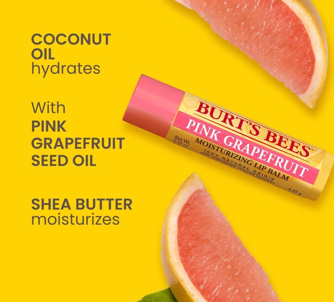 Burt's Bees Pink Grapefruit Lip Balm displayed with fresh grapefruit slices on a bright yellow background. Burt's Bees Pink Grapefruit Lip Balm displayed with fresh grapefruit slices on a bright yellow background.