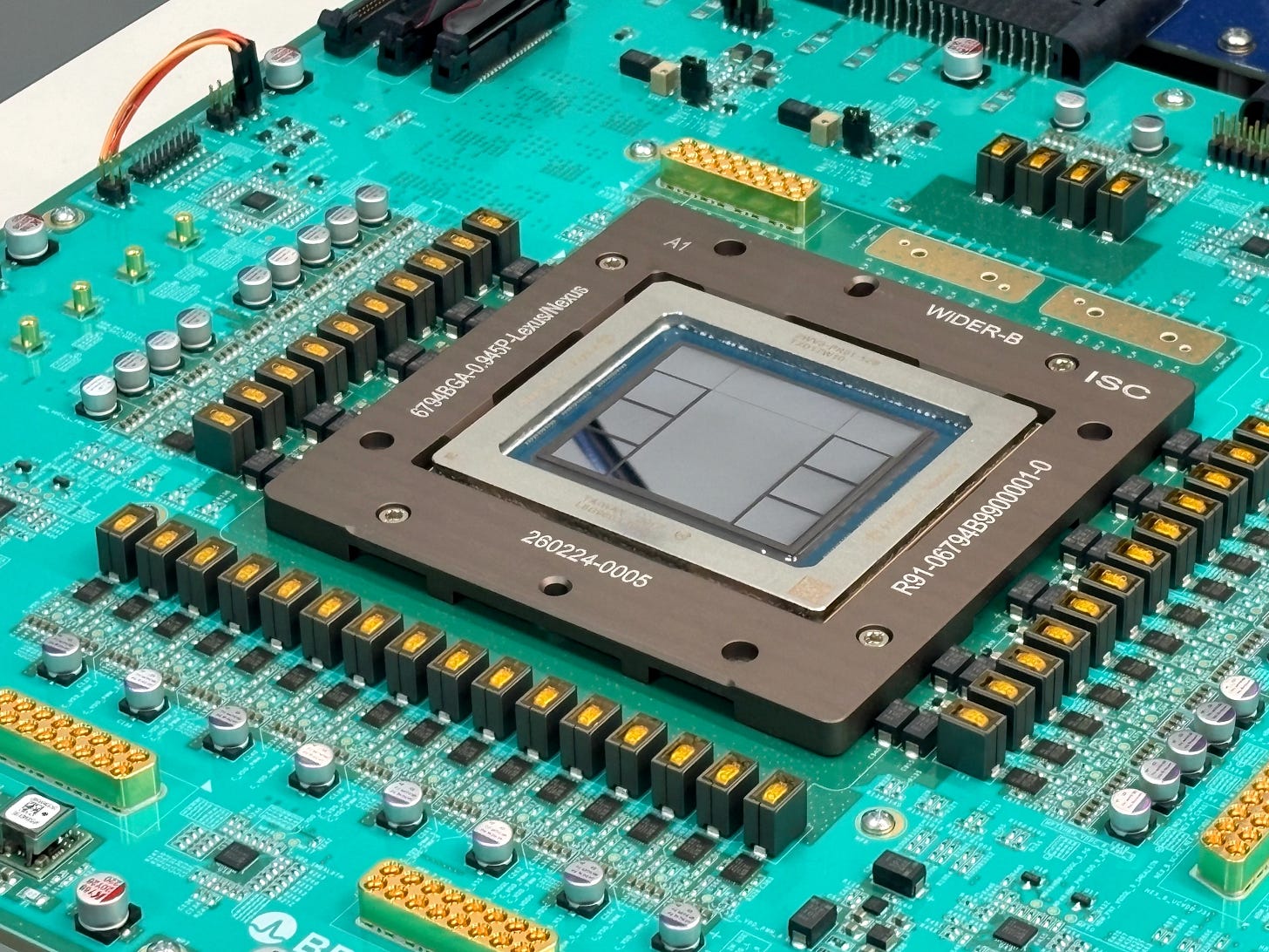 Close-up of the Jalapeño inference chip mounted on a teal circuit board. Close-up of the Jalapeño inference chip mounted on a teal circuit board.
