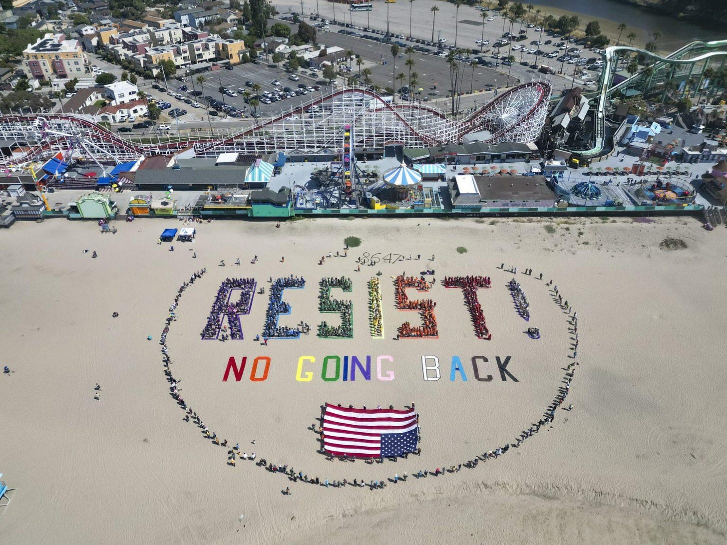 beach art where people spell out the word resist with their bodies beach art where people spell out the word resist with their bodies