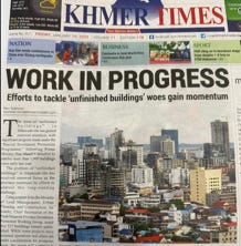 A newspaper with a city landscape

Description automatically generated