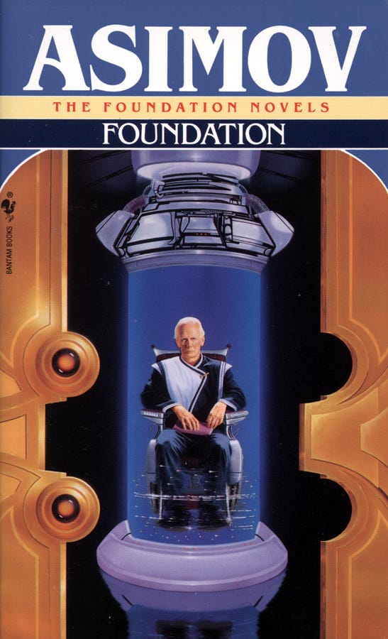 A man sits in a chair inside what looks like a giant circuit