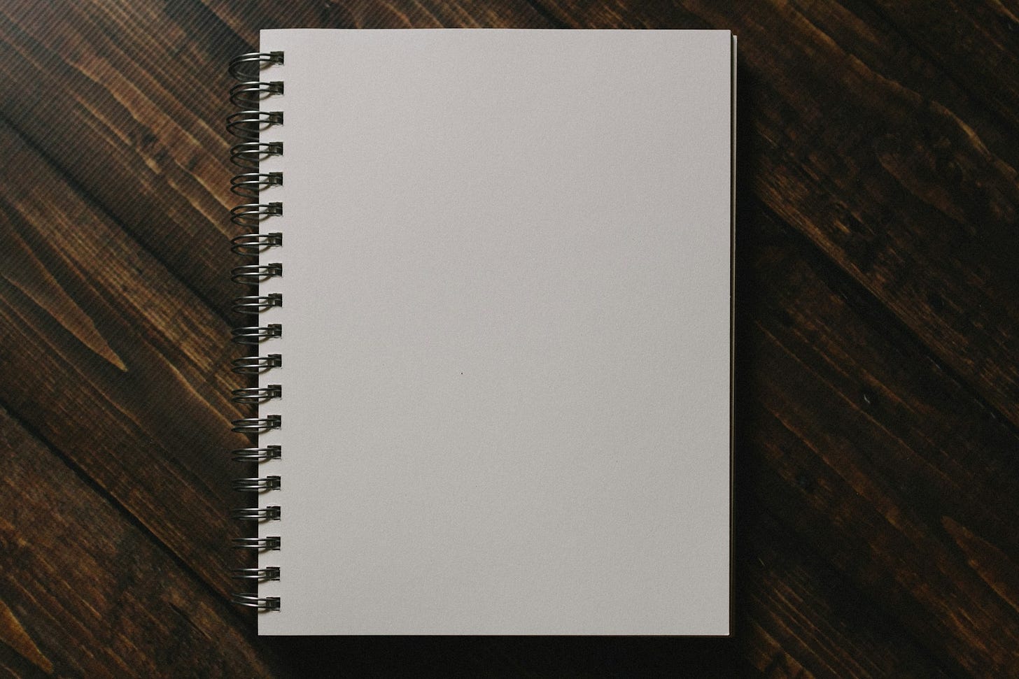 Blank notebook on a wooden table
