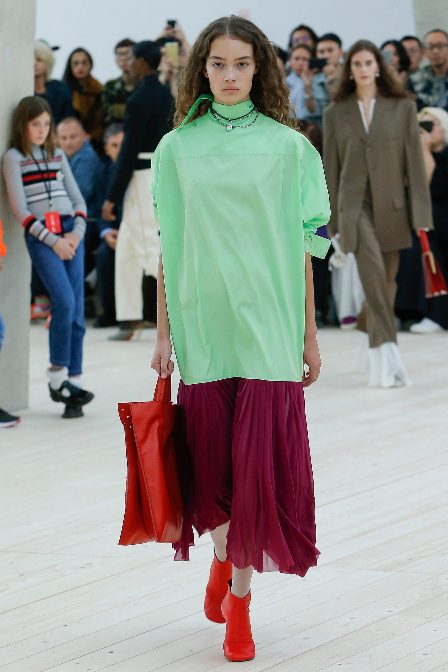 This image may contain Human Person Runway Fashion Clothing Apparel Footwear Shoe and Helmet