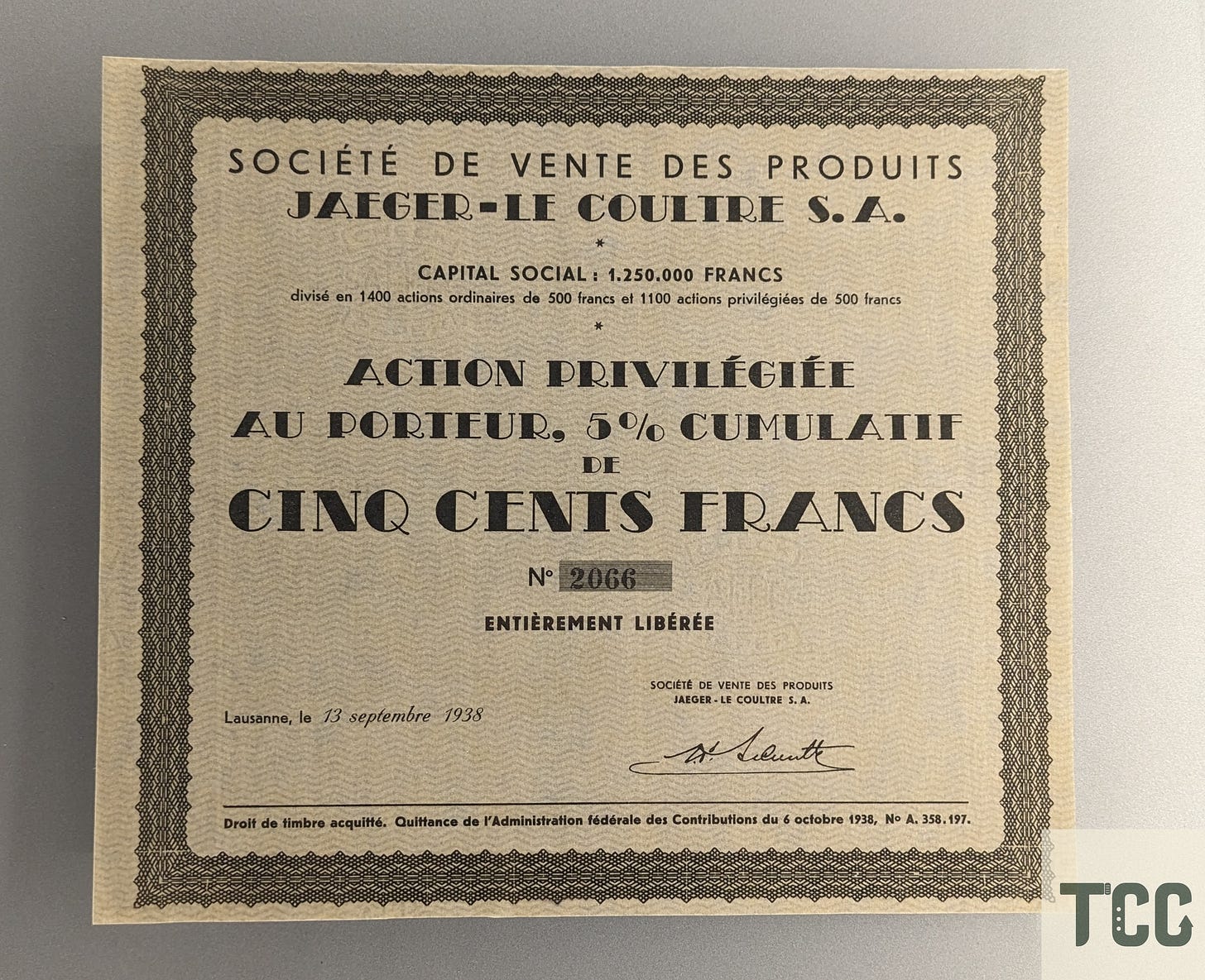 Vintage share certificate printed in French for Société de Vente des Produits Jaeger-LeCoultre S.A., dated September 13, 1938, showing a capital value of 500 francs with a 5% cumulative dividend. The certificate features decorative borders and the signature of an official representative.