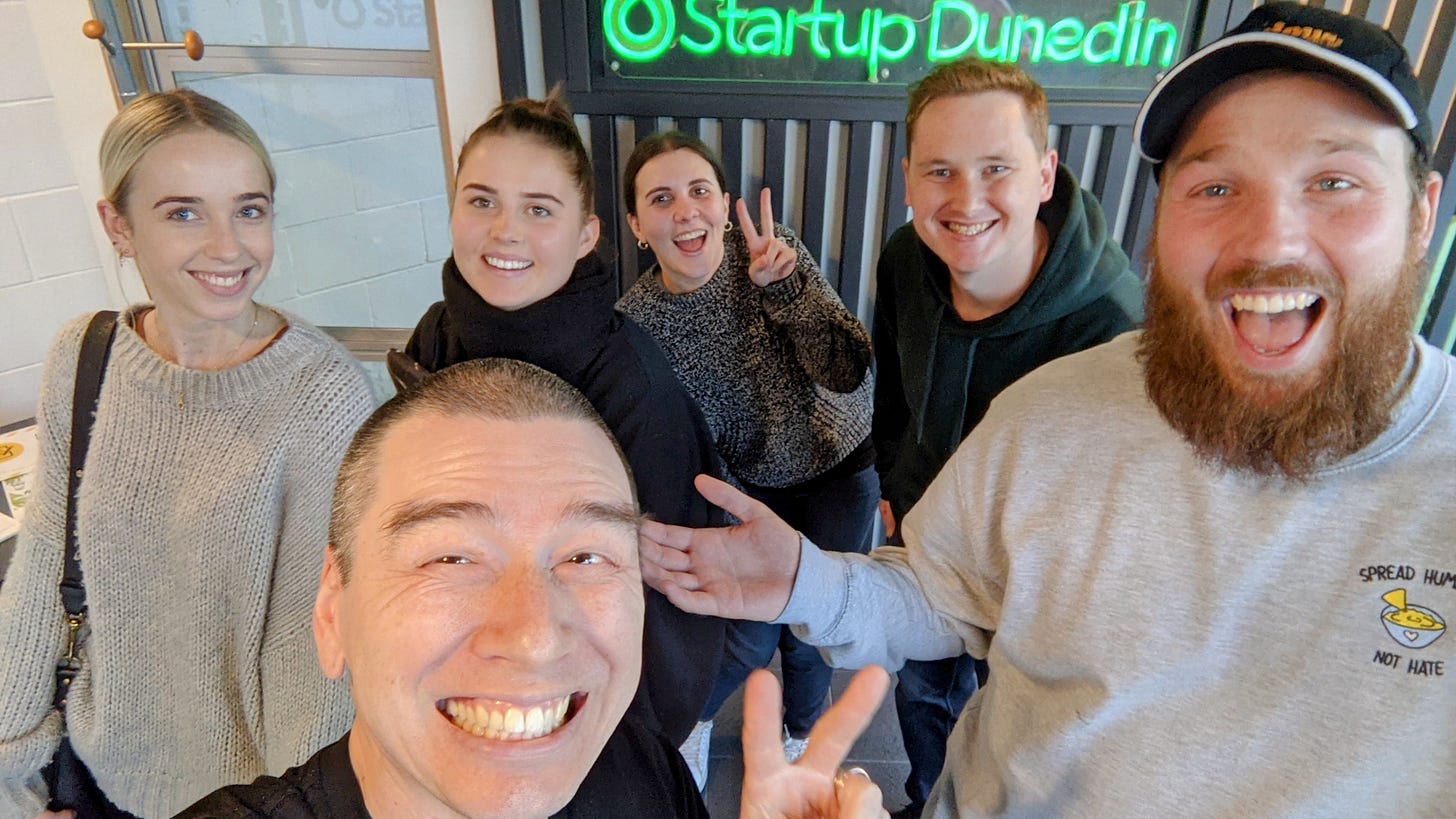 Selfie with Startup Dunedin sign and other smiling faces