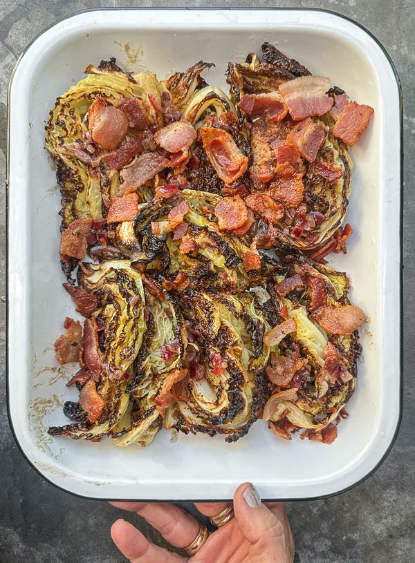 Try this Maple Bacon Cabbage recipe! Roasted cabbage wedges with crispy bacon and a homemade maple Dijon dressing. Easy, flavorful, gluten-free side dish for fall dinners, Thanksgiving, or meal prep. #vegetableside #cabbagerecipes #shutterbean