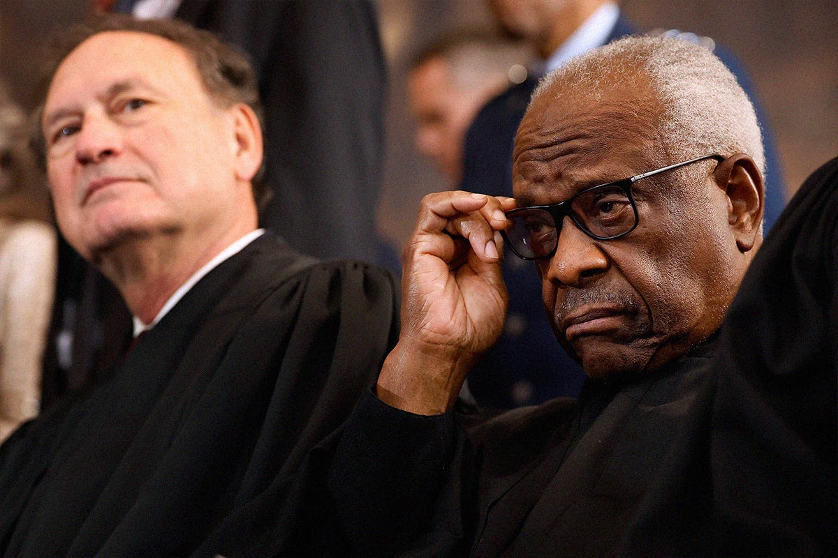 U.S. Supreme Court Associate Justices Samuel Alito (L) and Clarence Thomas wait for their opportunity to leave the stage at the conclusion of the inauguration ceremonies in the Rotunda of the U.S. Capitol on January 20, 2025 in Washington, DC.
