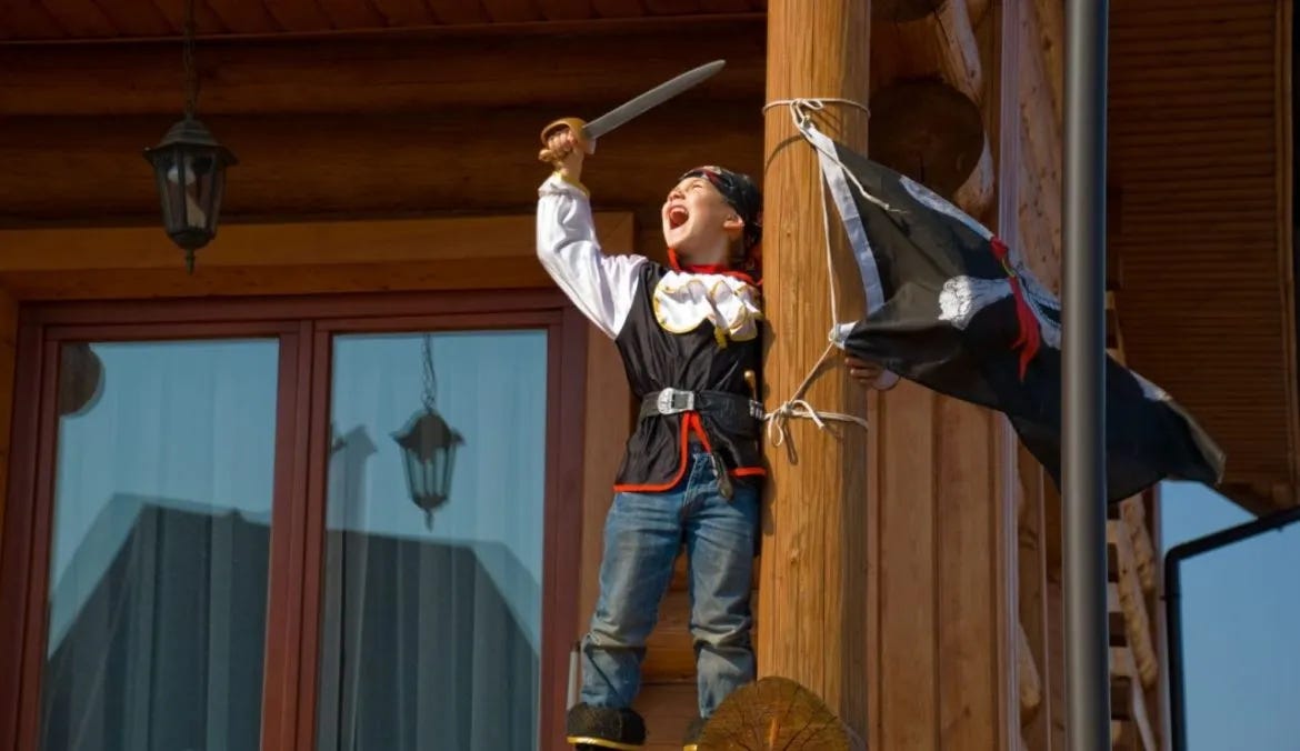 A boy dressed up like a pirate.