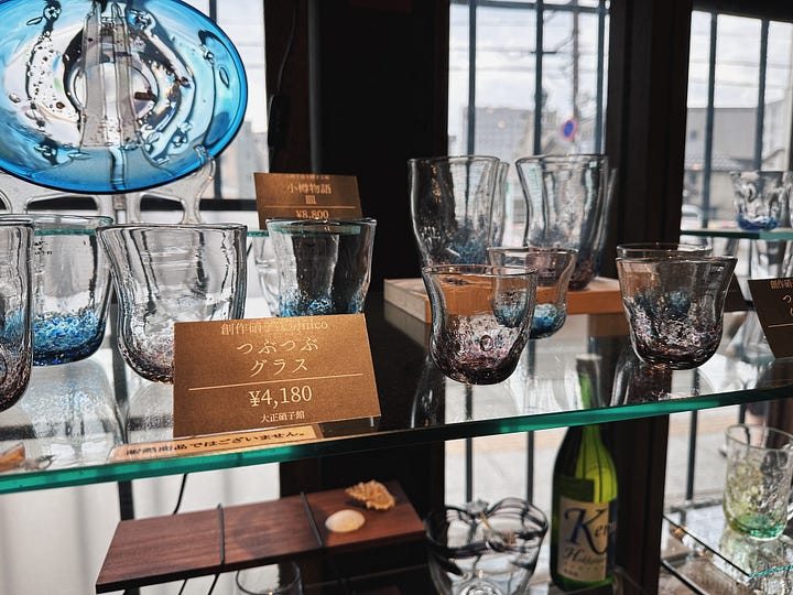 Scenes from Otaru, including a bowl of Hokkaido crab, the historic canal, handblown glassware, and the Otaru Music Box Museum