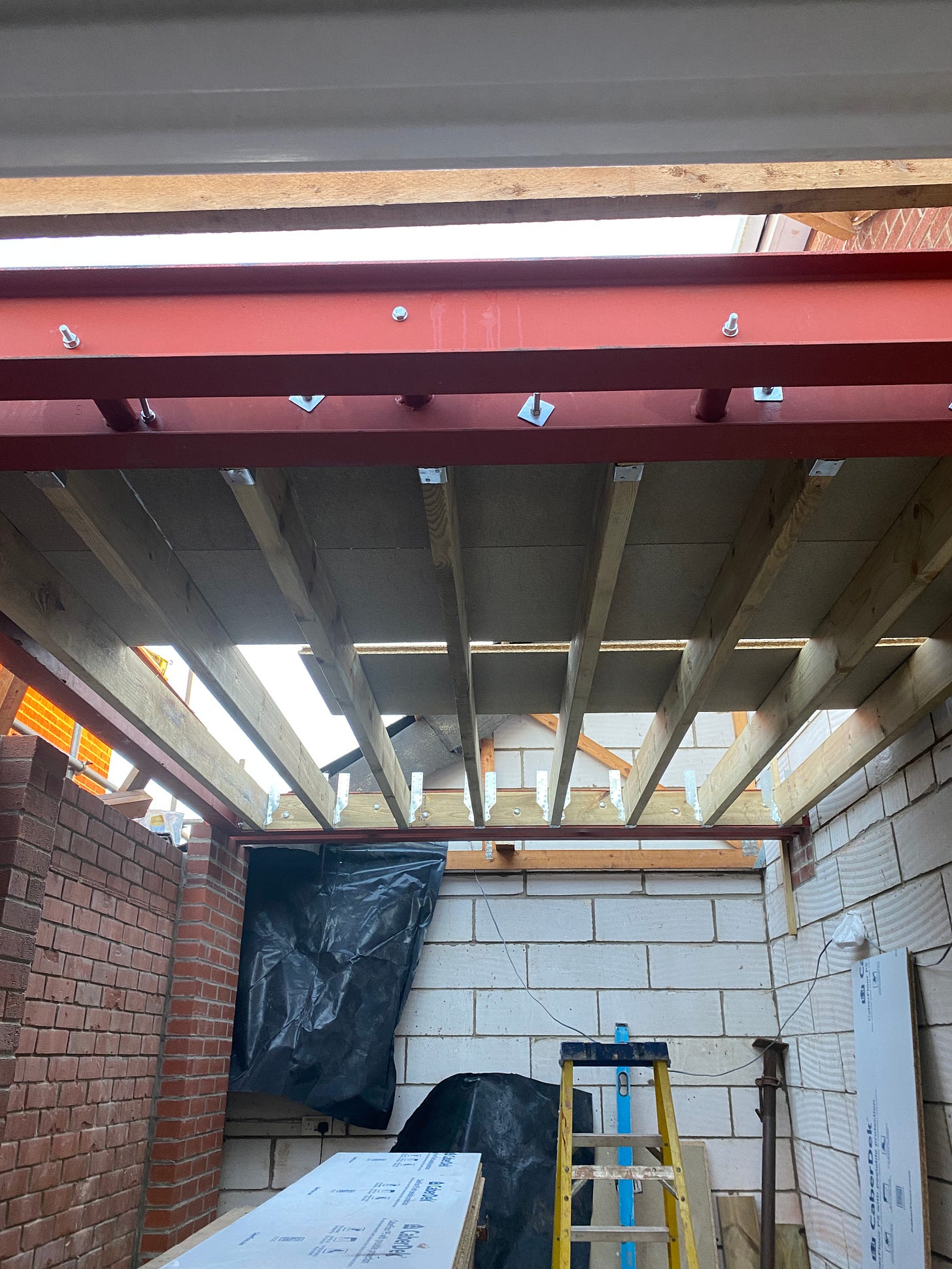 wooden joists attached to the steels