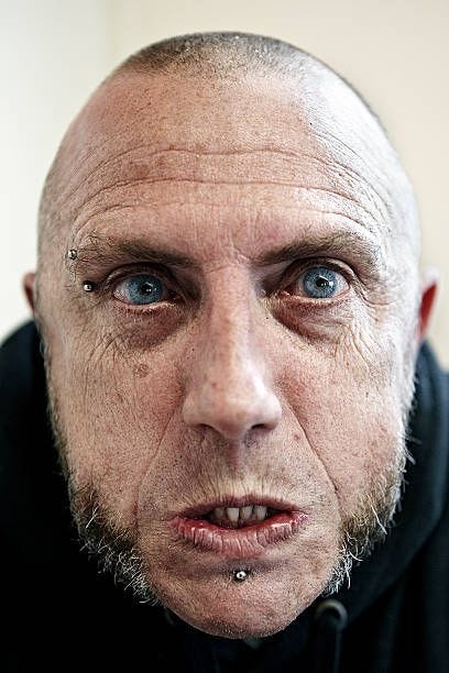close up skinhead male looking aggressive - angry man face stock pictures, royalty-free photos & images