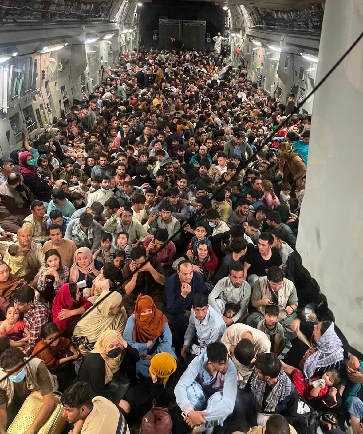 a large group of people in a tunnel a large group of people in a tunnel