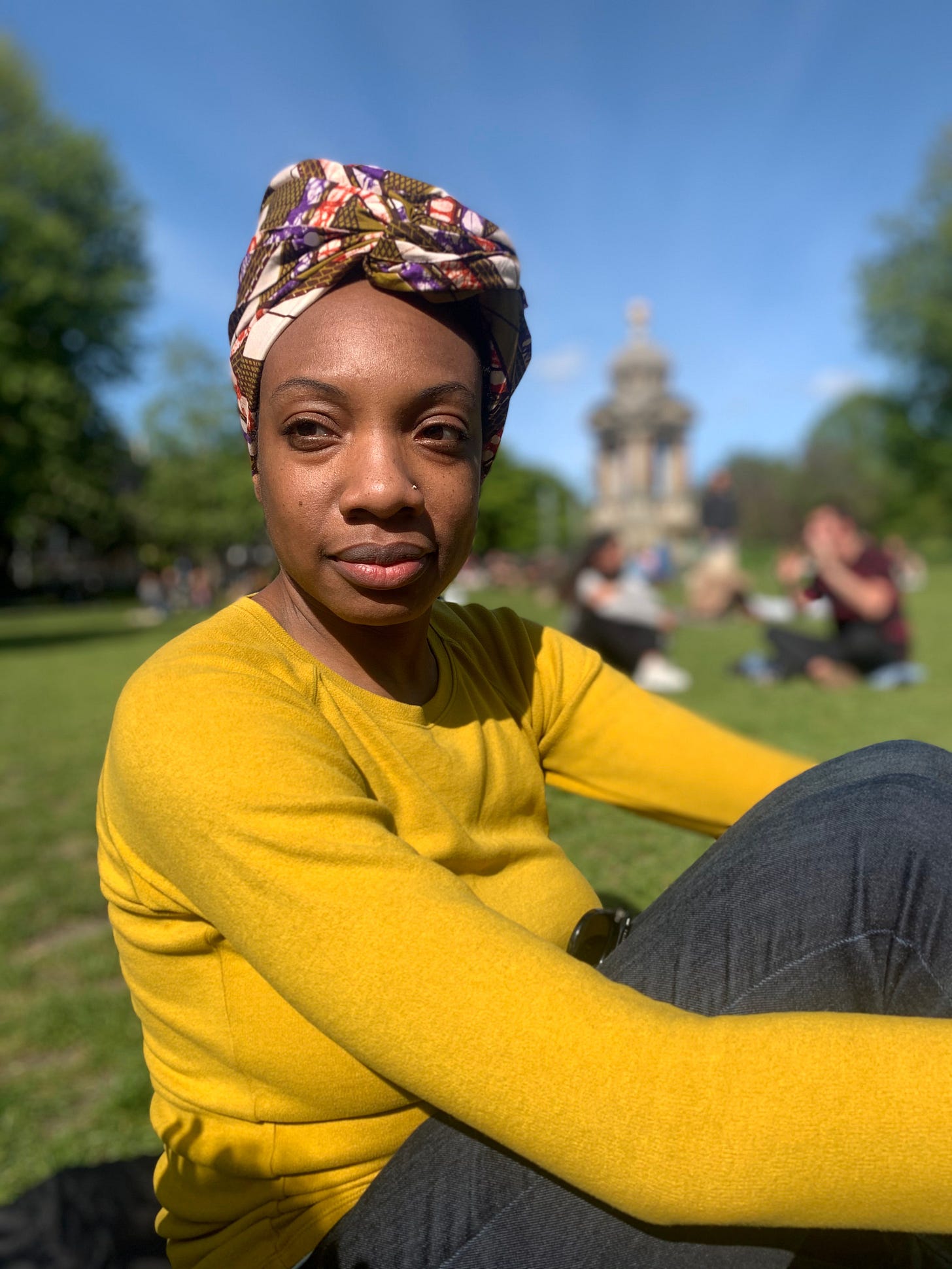 writer and editor Sherisa De Groot in a park in Amsterdam