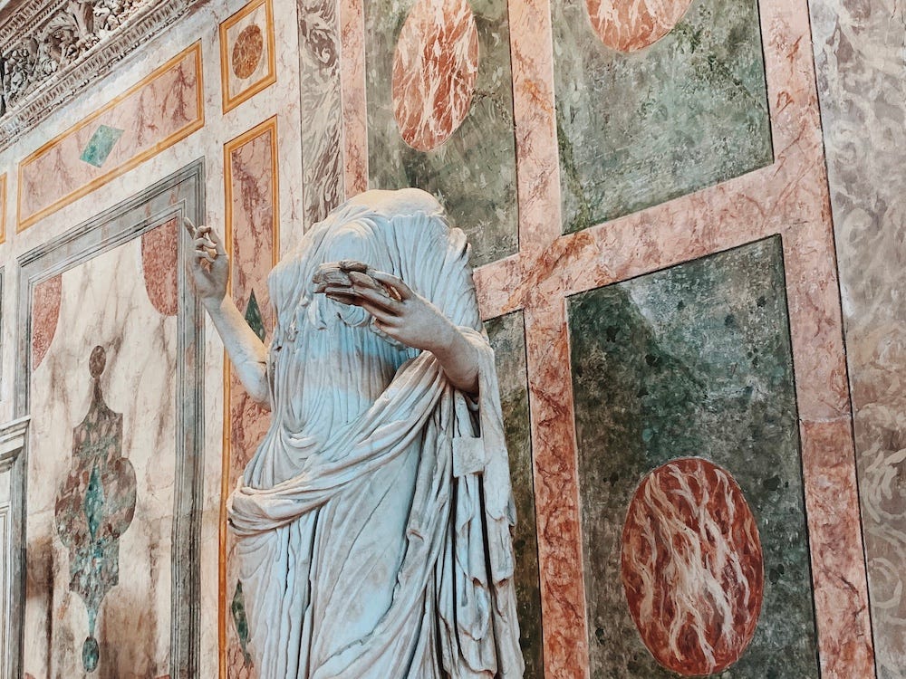An (actual) marble statue against faux-marble walls in the Palazzo Ducale, Mantova. An (actual) marble statue against faux-marble walls in the Palazzo Ducale, Mantova.