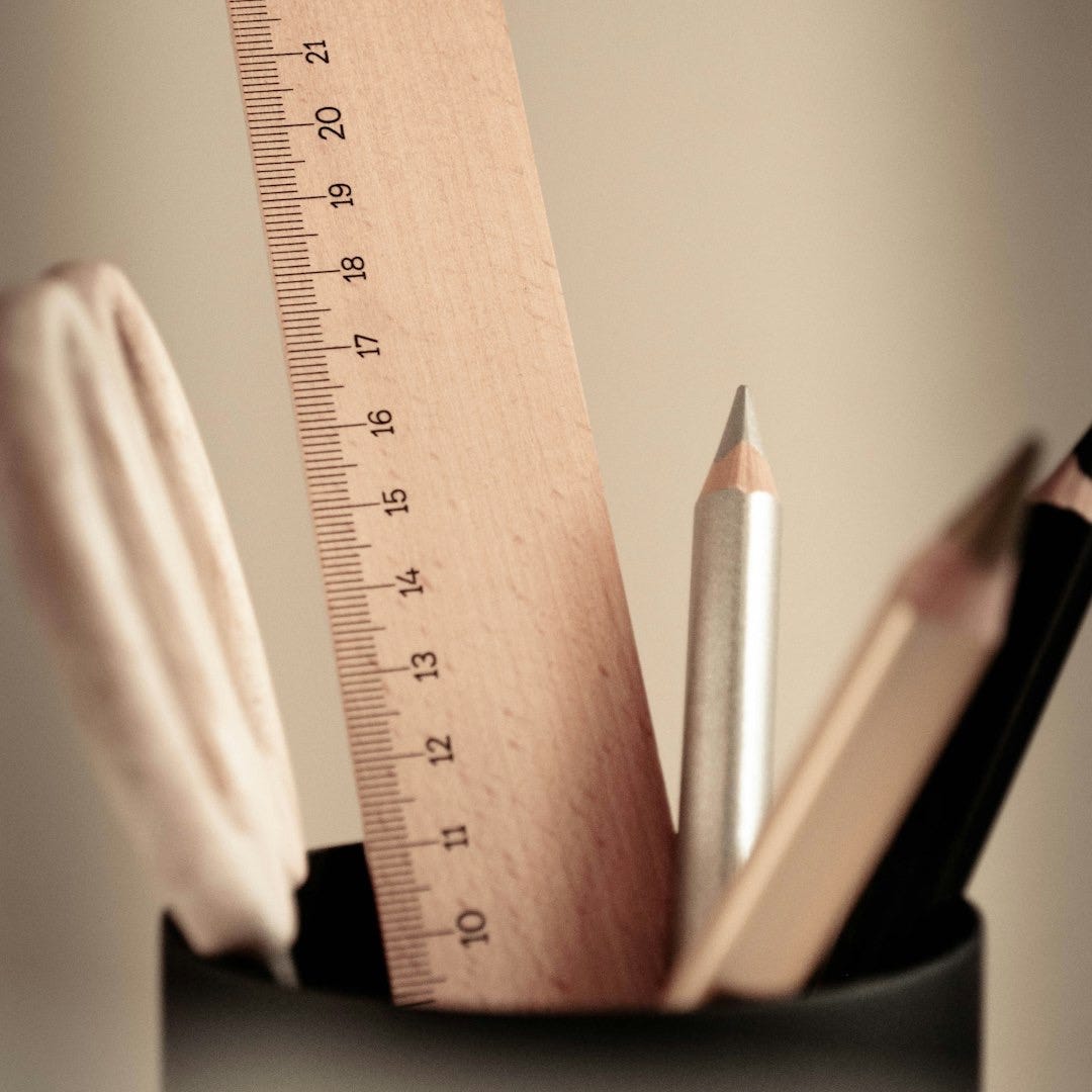 brown wooden ruler and pencil brown wooden ruler and pencil