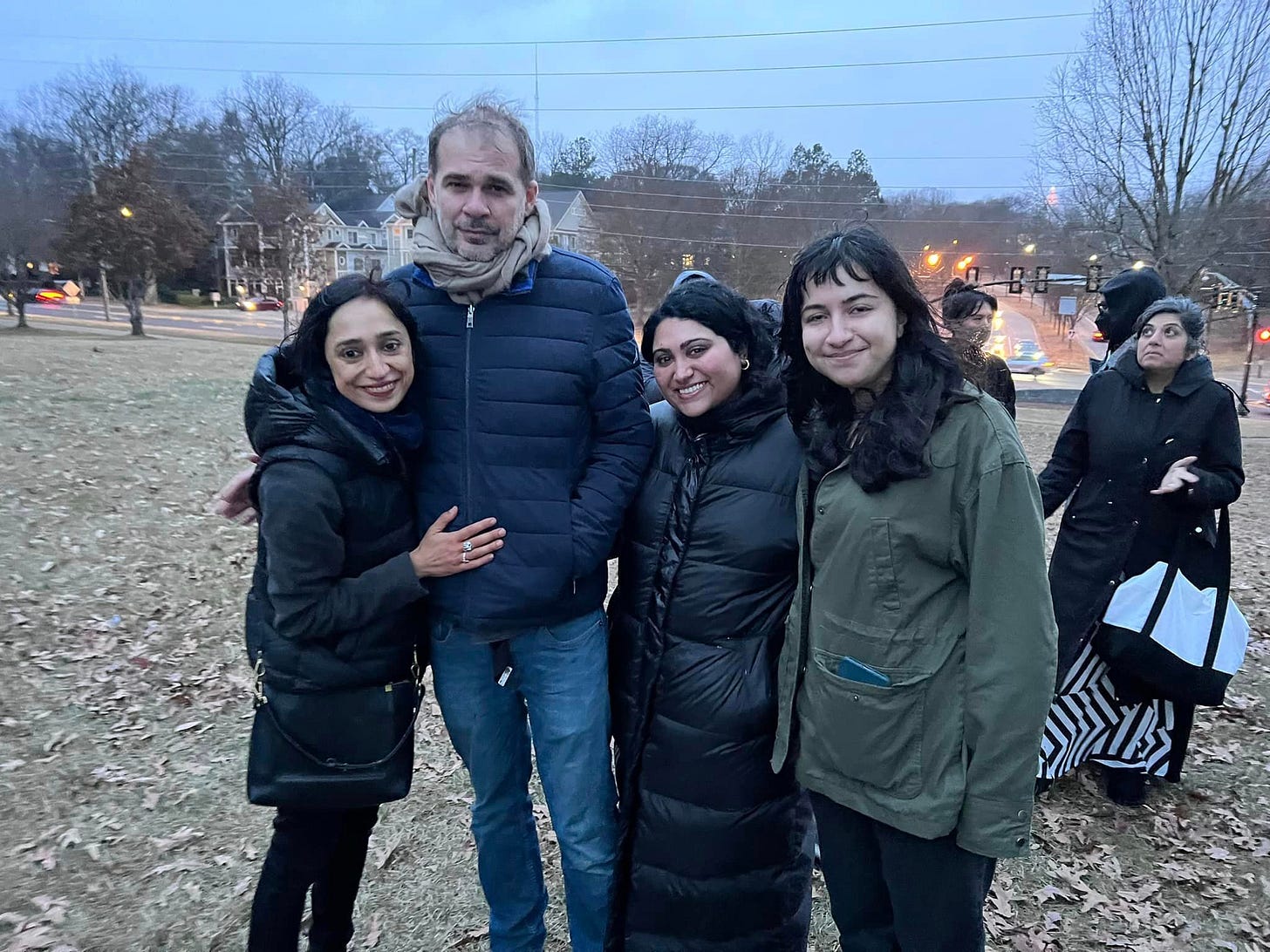 Photo of Sophia, Mat, myself and Sonam, organizers of the vigil. Sophia, Sonam and myself are South Asian. Mat is British.