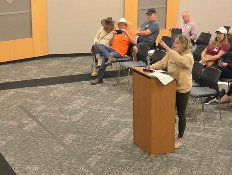A parent demands district superintendent Theresa Williams look at her while she complains about books in Plano ISD