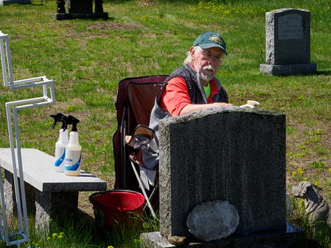 Carl cleaning gravestones