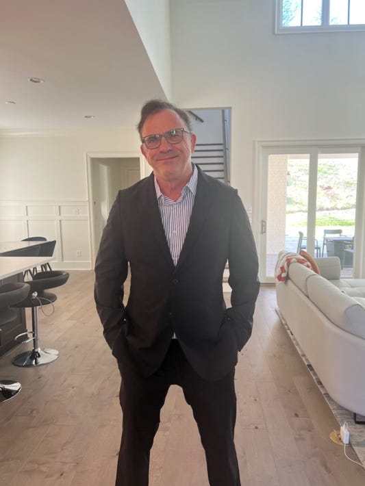 A person in a suit

Description automatically generated