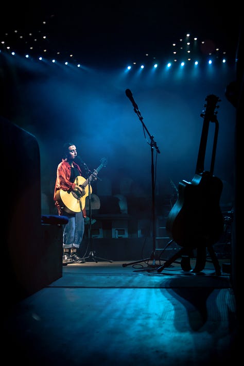 A series of images from Manic Street Creature, where Maimuna plays guitar on stage