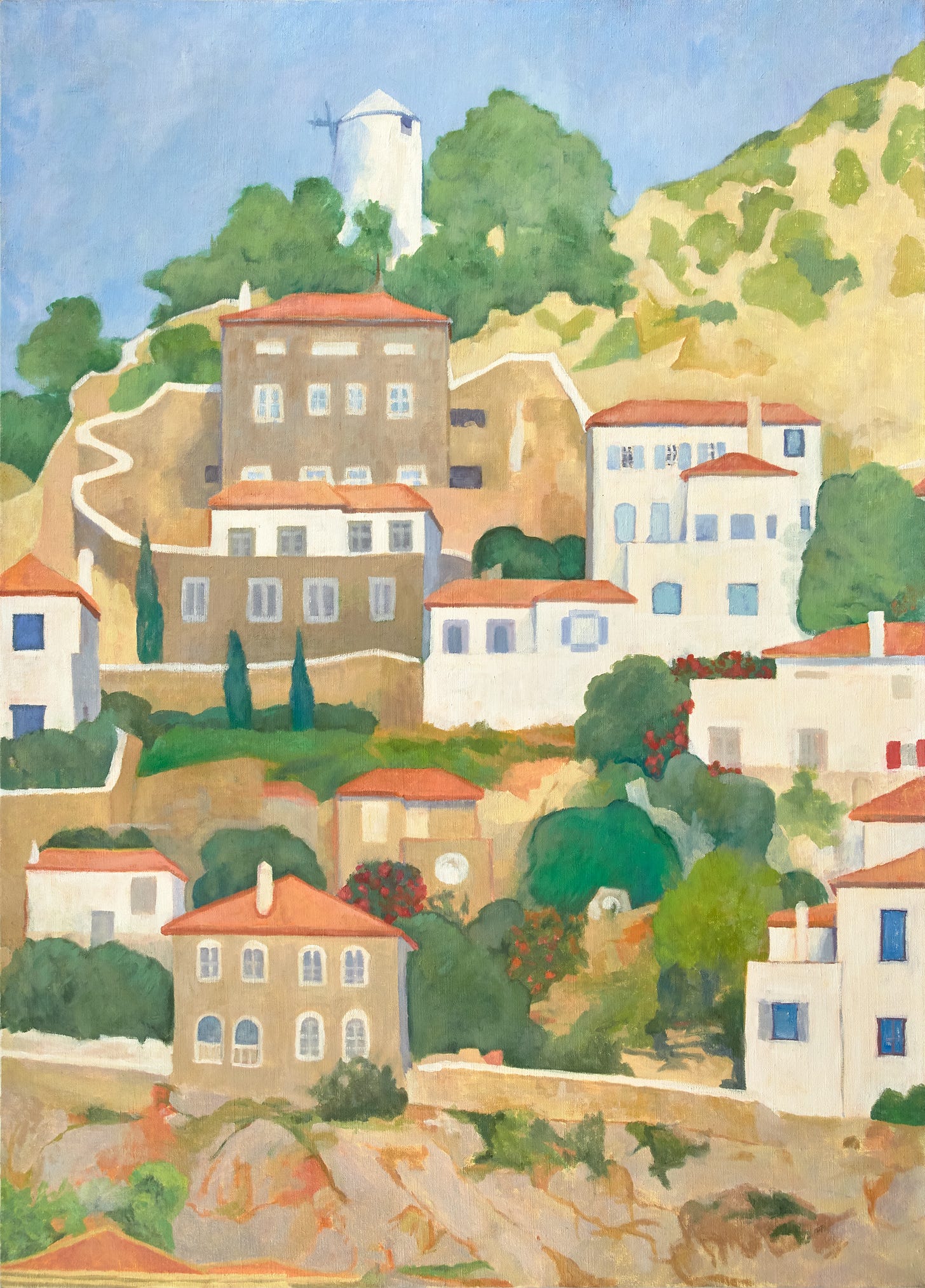 Tightly clustered houses with terracotta roofs climb a hillside into a brilliant blue sky among green trees. Among them is a grain silo with a conical top.