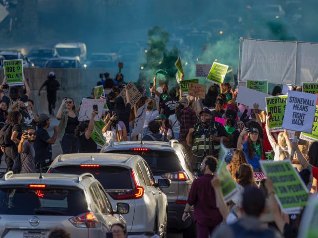 LOS ANGELES, CA - JUNE 24: Green smoke rises as protesters march northbound on the 110 Freeway as they denounce todays US Supreme Court decision overturning "Roe v Wade" on June 24, 2022 in downtown Los Angeles, United States. The US Supreme Court ended the right to abortion in a … LOS ANGELES, CA - JUNE 24: Green smoke rises as protesters march northbound on the 110 Freeway as they denounce todays US Supreme Court decision overturning "Roe v Wade" on June 24, 2022 in downtown Los Angeles, United States. The US Supreme Court ended the right to abortion in a …