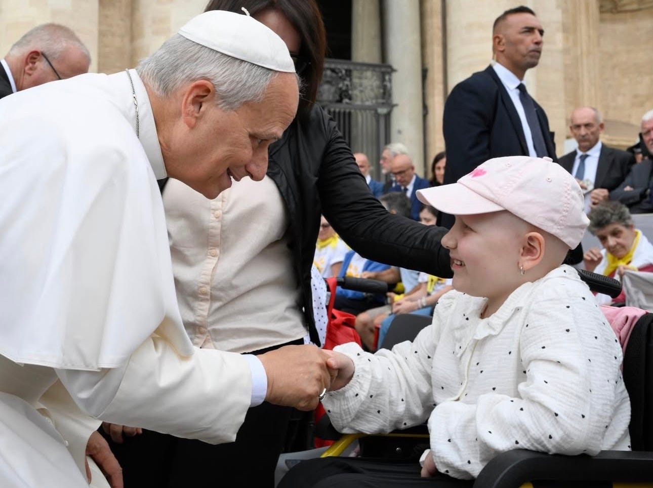 Pope Leo XIV greets a young girl in a wheelchair in St. Peter’s Square Pope Leo XIV greets a young girl in a wheelchair in St. Peter’s Square