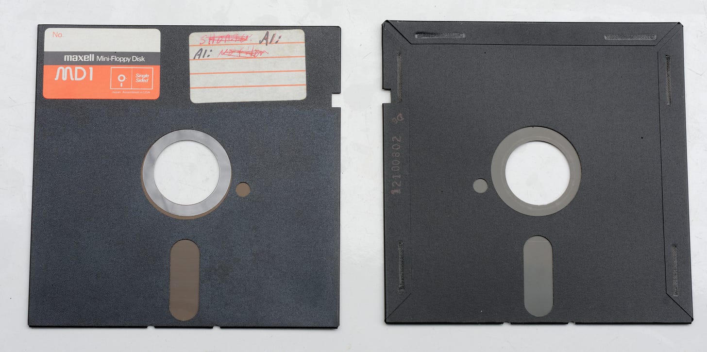 Front and back of a 5 1/4 inch floppy disk Front and back of a 5 1/4 inch floppy disk