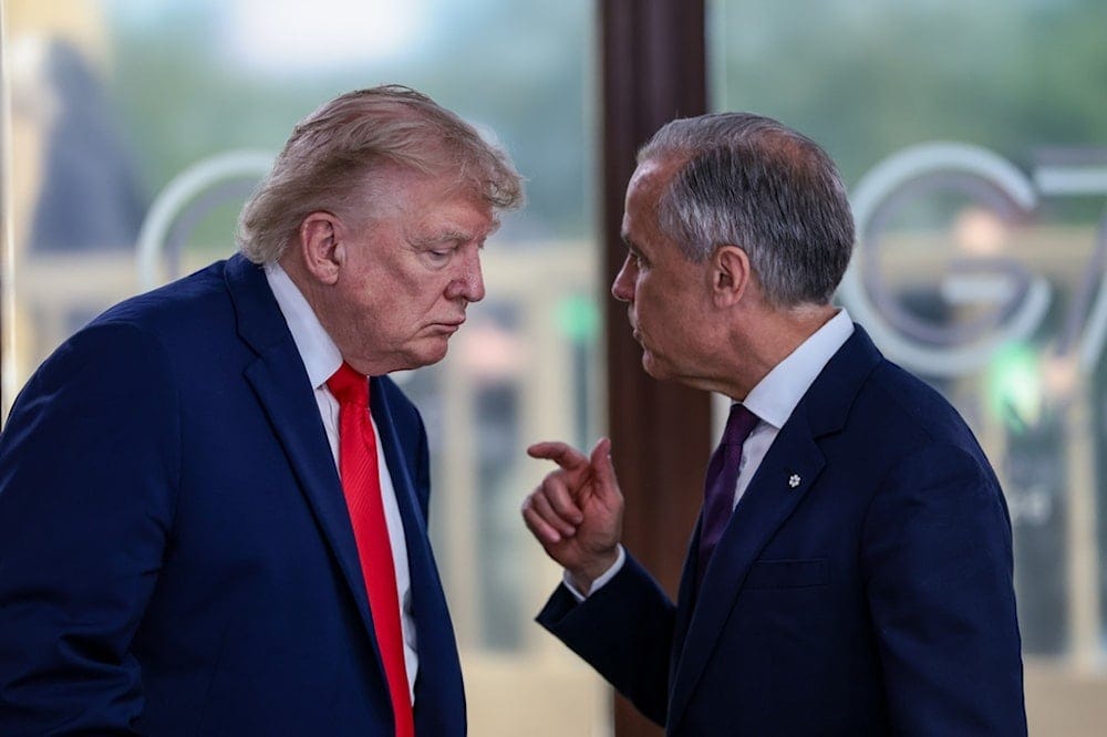 US President Donald Trump speaks with Canadian Prime Minister Mark Carney, right, at a working lunch with leaders of G7 and West Asia in Evian-les-Bains, France, Tuesday, June 16, 2026. (Evelyn Hockstein/Pool Photo via AP,File)