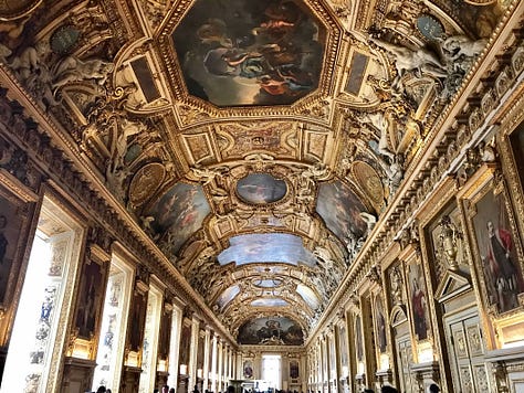 The author's pictures at the Louvre, Montremarte, Moulin rouge, and some city views