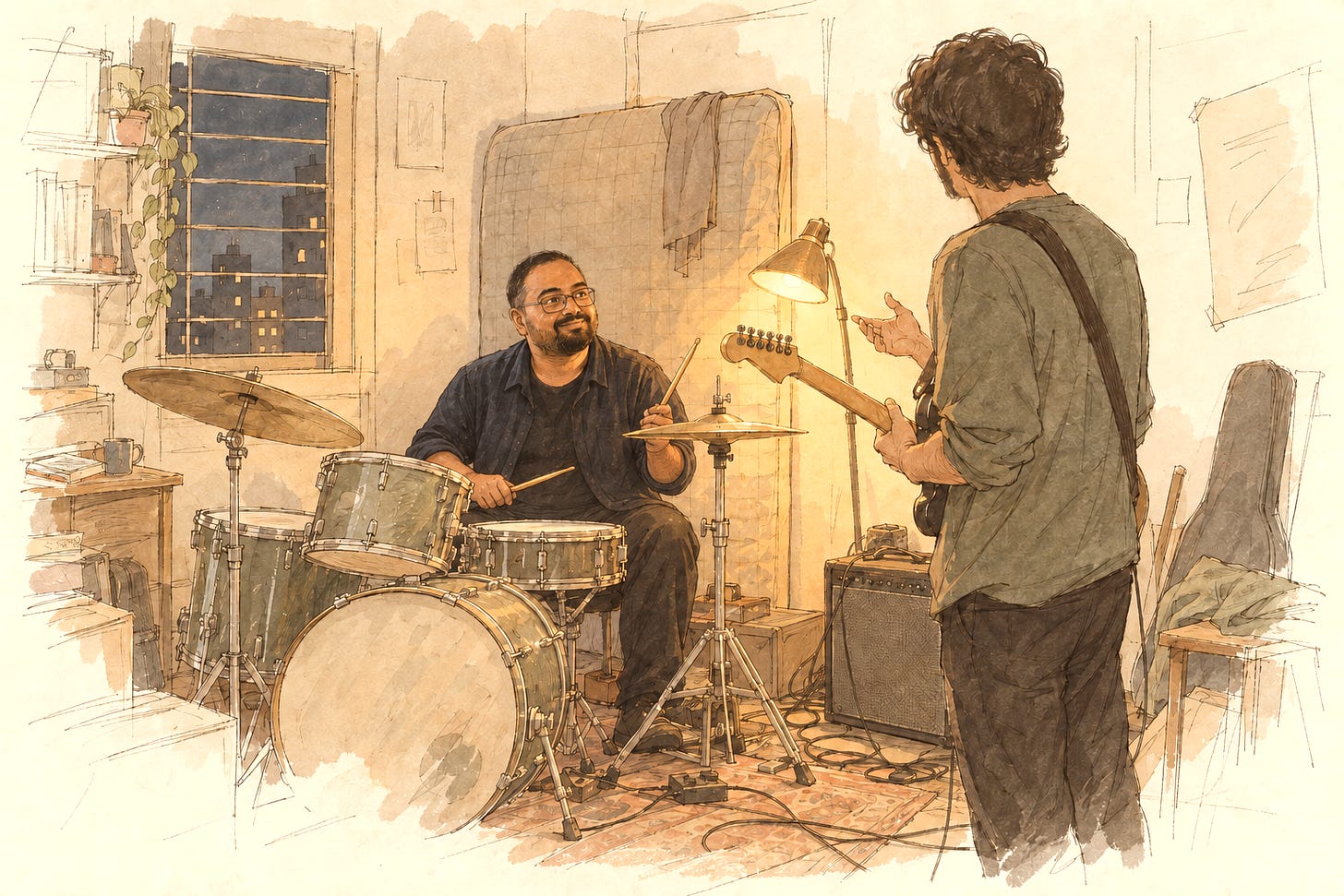 A band rehearsal room at night, a drummer smiling up from his kit at a guitarist seen from behind. A band rehearsal room at night, a drummer smiling up from his kit at a guitarist seen from behind.