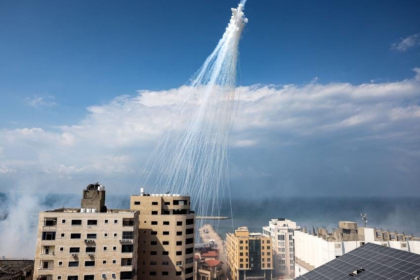 Airbursts of artillery-fired white phosphorus fall over the Gaza city port, October 11, 2023. Airbursts of artillery-fired white phosphorus fall over the Gaza city port, October 11, 2023.