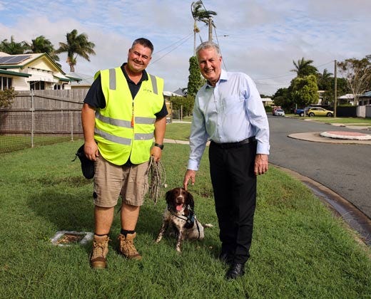 Troy Meehan, handler, with Splash (water leak detecting dog) and Mayor Greg Williamson Troy Meehan, handler, with Splash (water leak detecting dog) and Mayor Greg Williamson