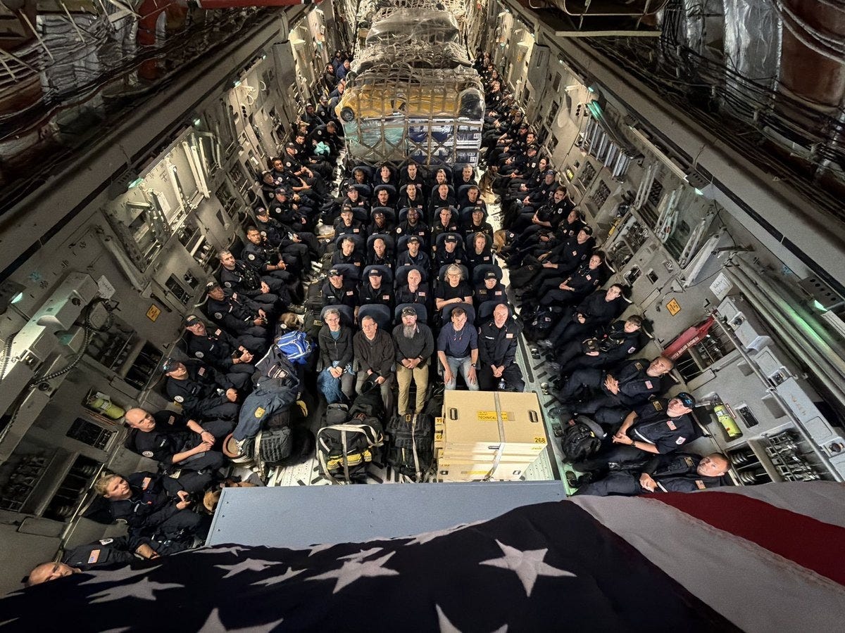 Urban Search & Rescue (USAR) team members aboard a USAF C-17 en route to Venezuela (US State Dept. photo)