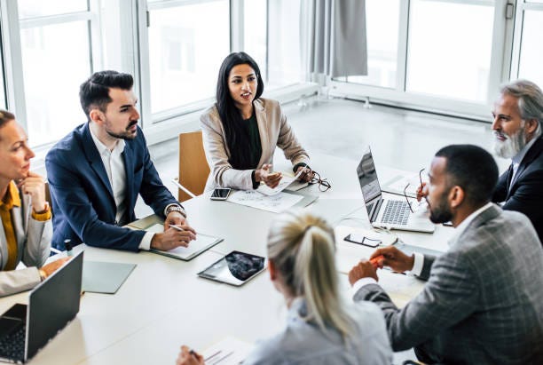 Business people having a meeting in the board room Business people having a meeting in the board room