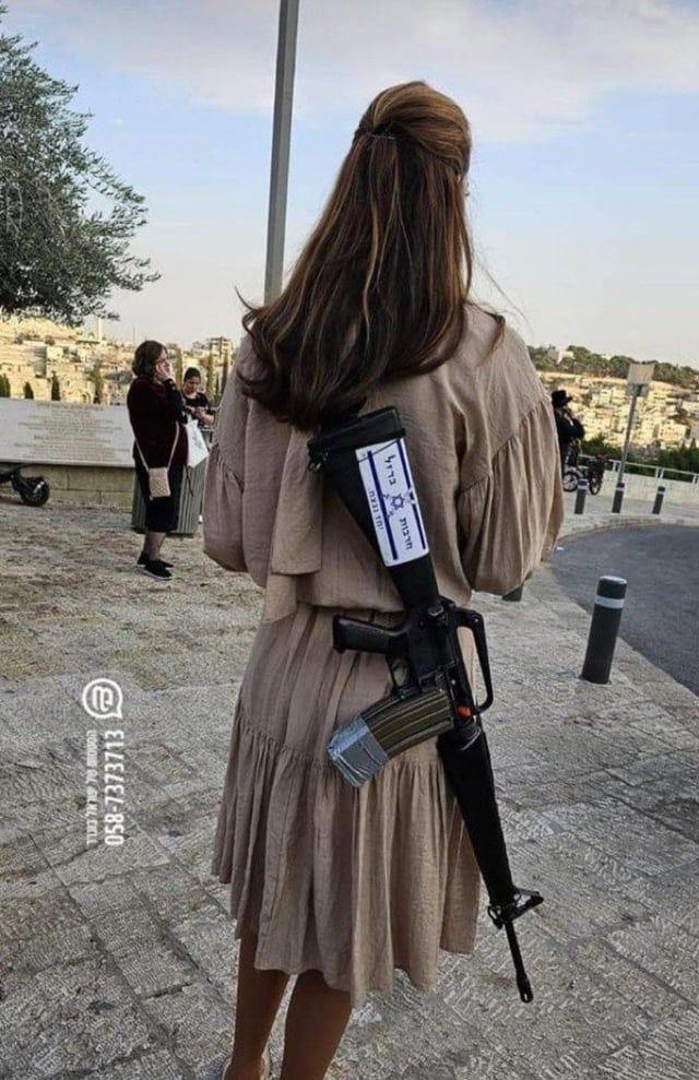 Reservist in civilian clothes, from the (IDF) Israeli Defense Forces, with  her weapon and two magazines taped together - in the city of Jerusalem.  [1063 x 1644] : r/MilitaryPorn