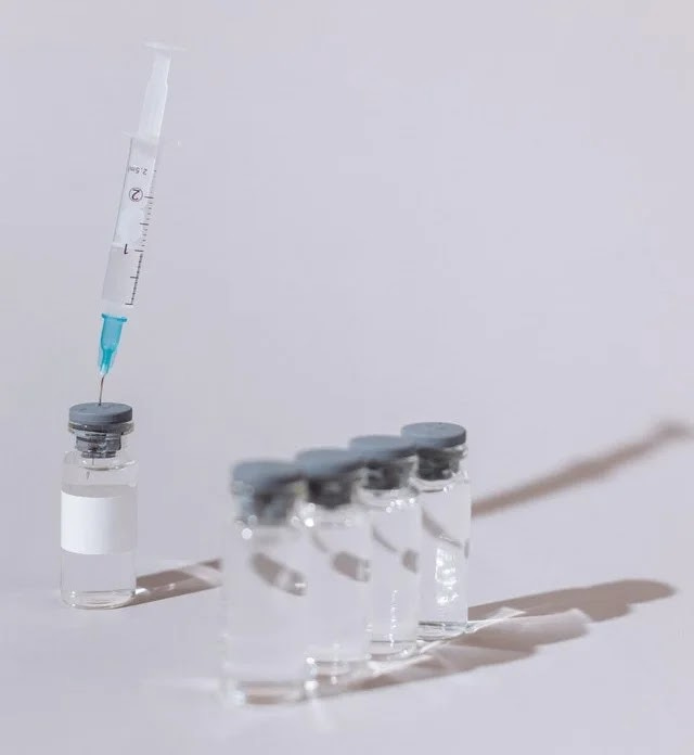 Vaccine vials and syringe