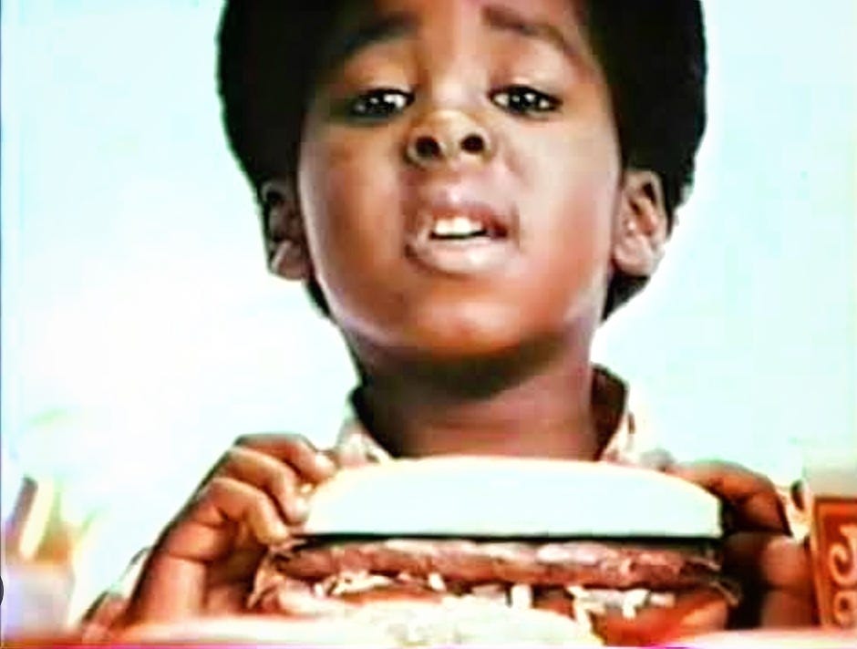 Rodney Allen Rippy attempts to eat one of the larger items off the Jack in the Box menu.