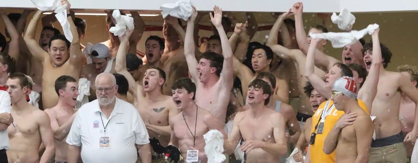 The Big Red men's team cheering during day 2 of the NCAC championships 2025
