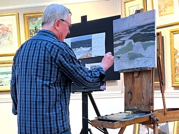 A person painting on a canvas

AI-generated content may be incorrect.