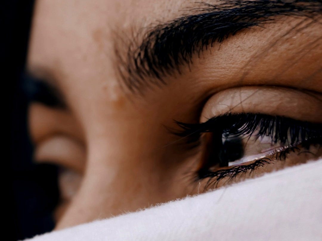 shallow focus of a woman's sad eyes shallow focus of a woman's sad eyes