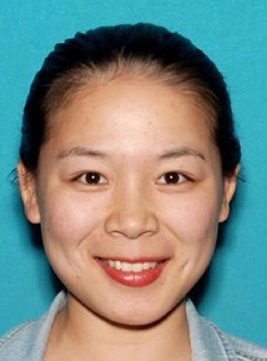 Portrait of Wanying Zhang facing the camera against a blue background. Portrait of Wanying Zhang facing the camera against a blue background.