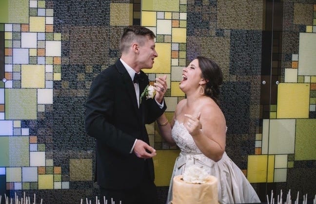 That's right. Focus here. On these cute, adorable love birds who have no idea about the cake catastrophe in front of them. Aren't they wonderful? Honestly, trust me, they are. That's right. Focus here. On these cute, adorable love birds who have no idea about the cake catastrophe in front of them. Aren't they wonderful? Honestly, trust me, they are.