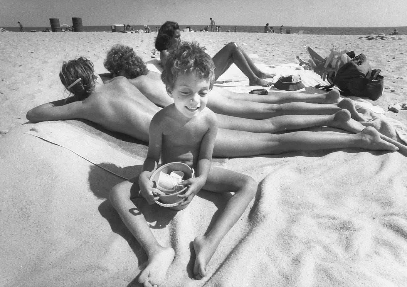 1981: A young bather at Moonstone Beach in South Kingston appears uninterested in beautiful bodies. Nude bathing soon may be banned at the beach. 1981: A young bather at Moonstone Beach in South Kingston appears uninterested in beautiful bodies. Nude bathing soon may be banned at the beach.